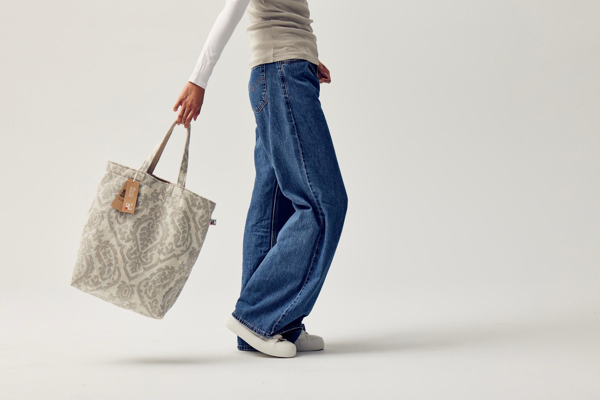 female holding tote bag