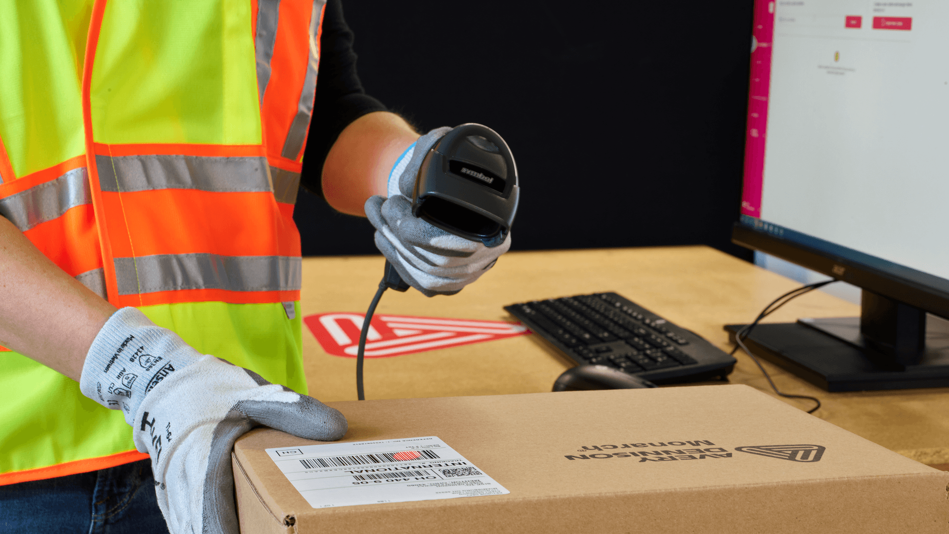 Person using scanner equipment to locate products in a distribution center 