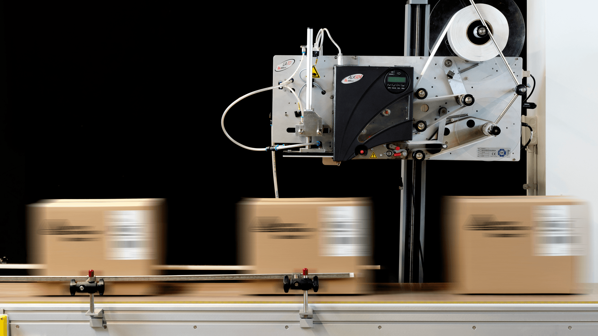 factory employee using an in-plant table top label printer