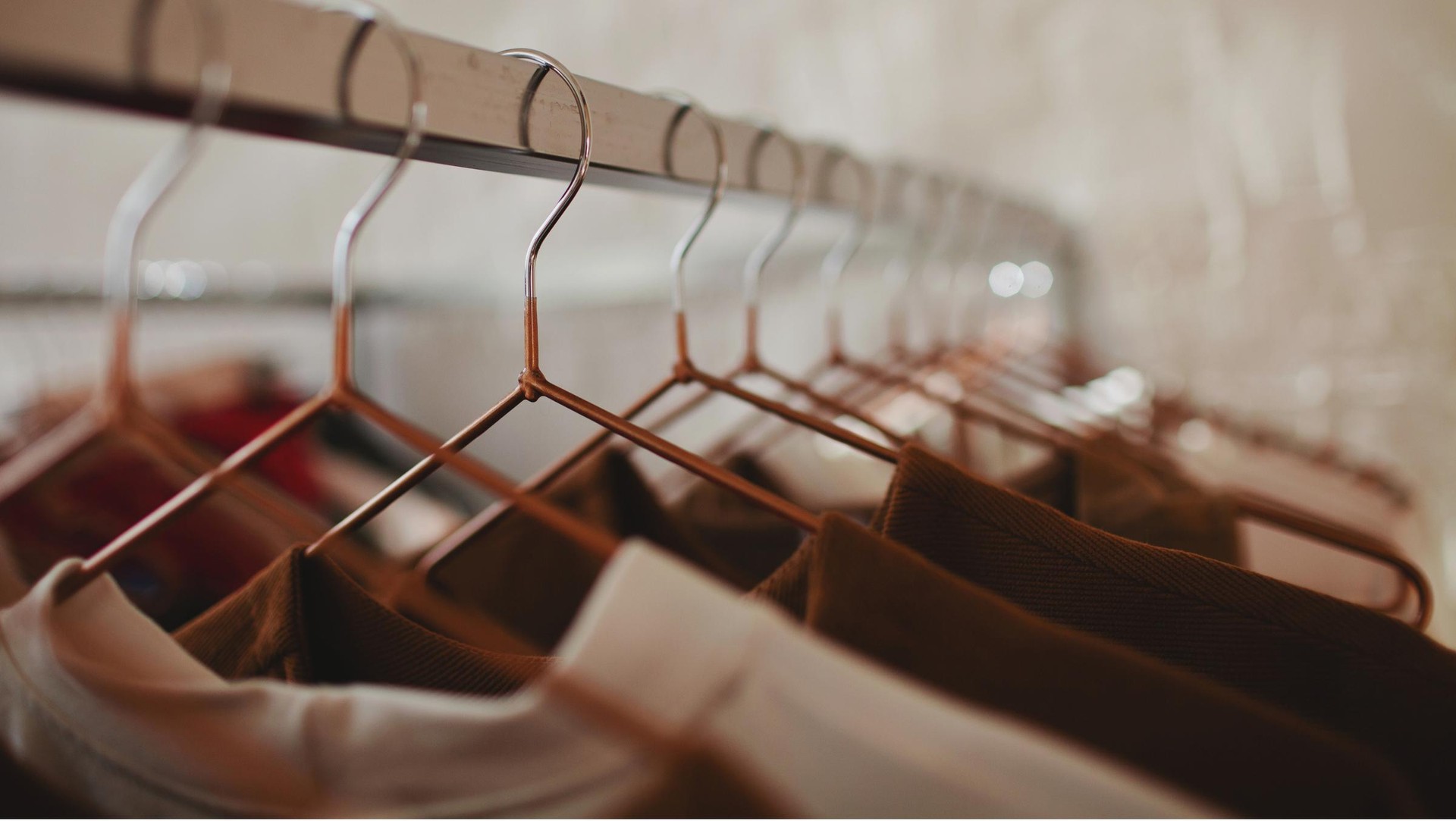 Apparel garments hanging  in a retail environment